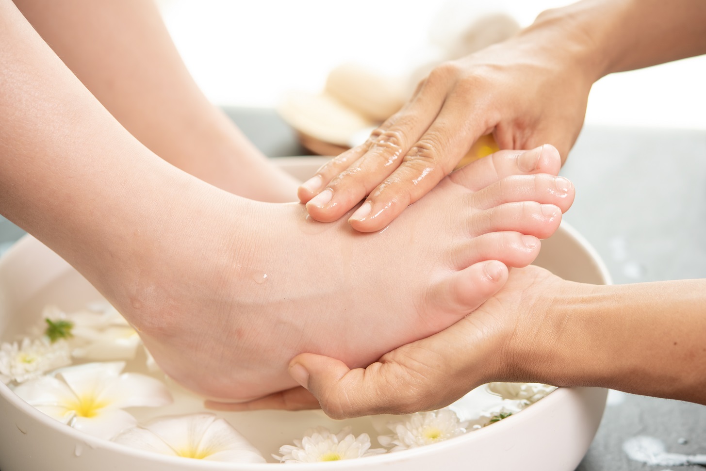 Foot Washing In Spa Before Treatment. Spa Treatment And Product